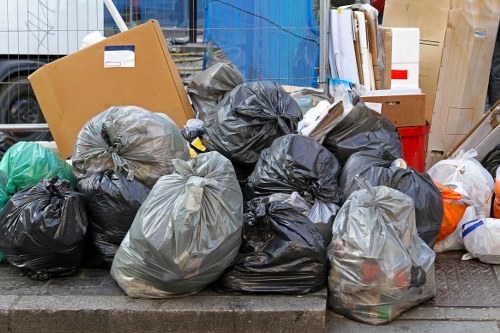 Builders managing waste on a construction site